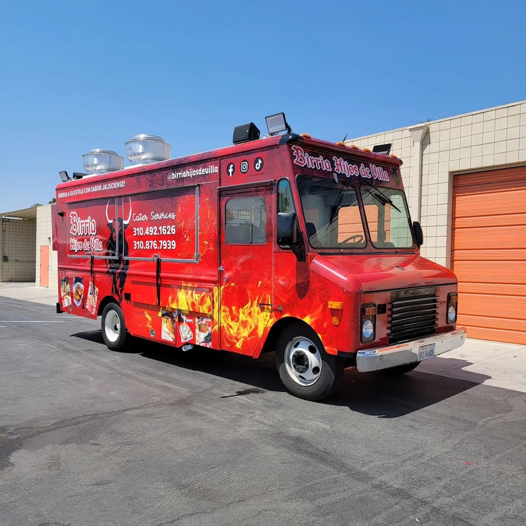 Birria Hijos de Villa red fire-themed food truck wrap