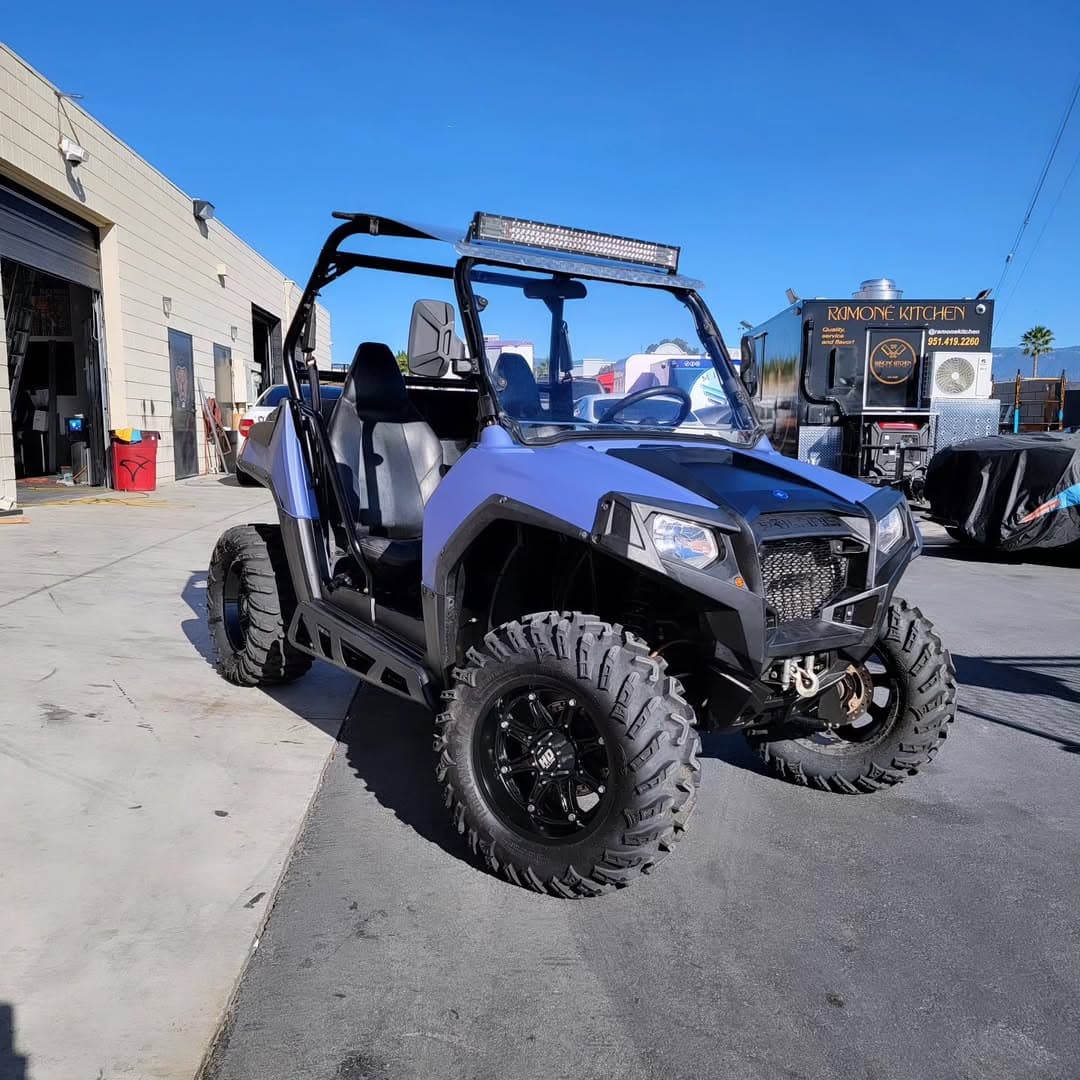 Purple Polaris RZR side-by-side off-road vehicle wrap
