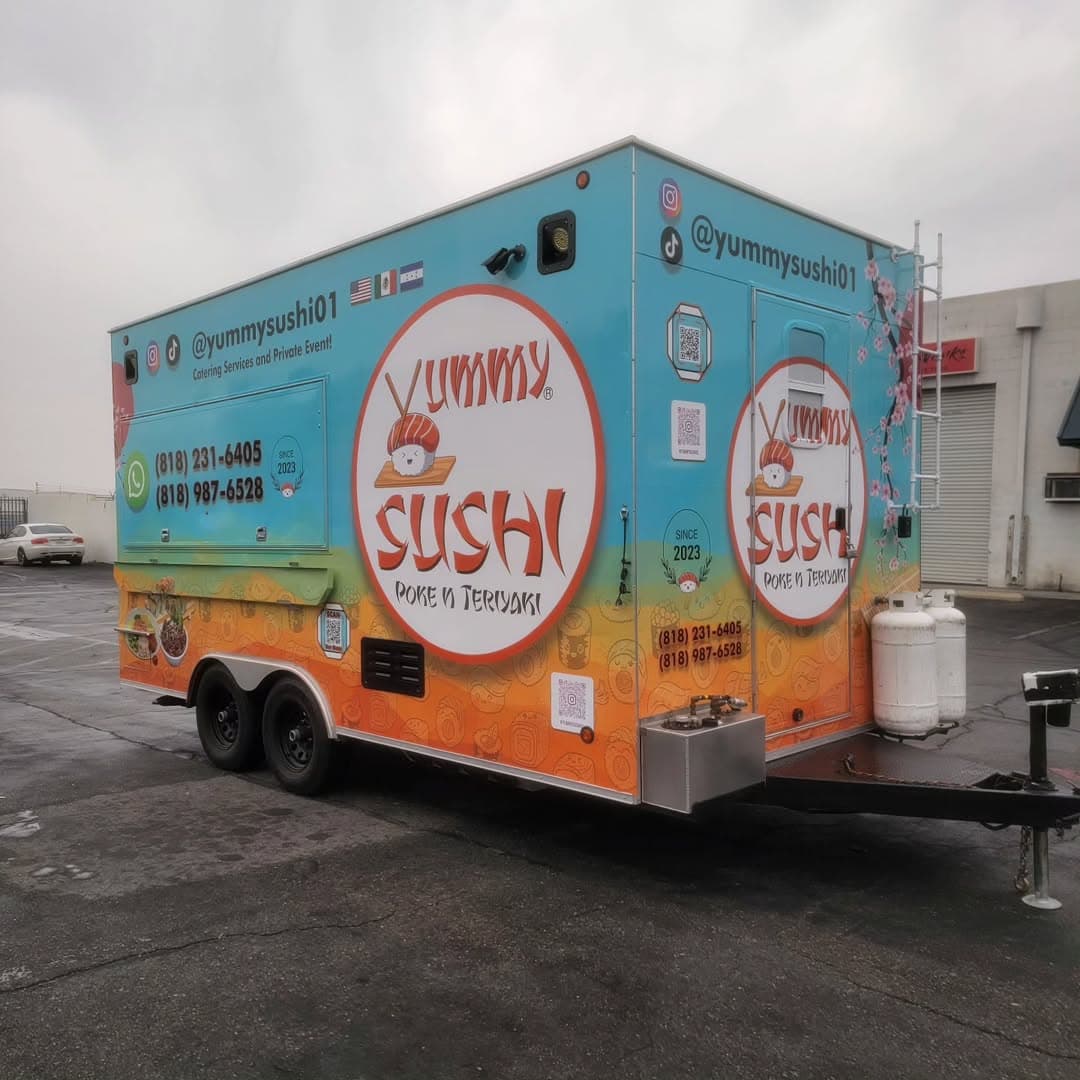 Food truck wrap with bold branding on a city street
